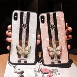 some one holding tow Luxury Diamond Butterfly Mirror iPhone Case – Glamorous and Protective