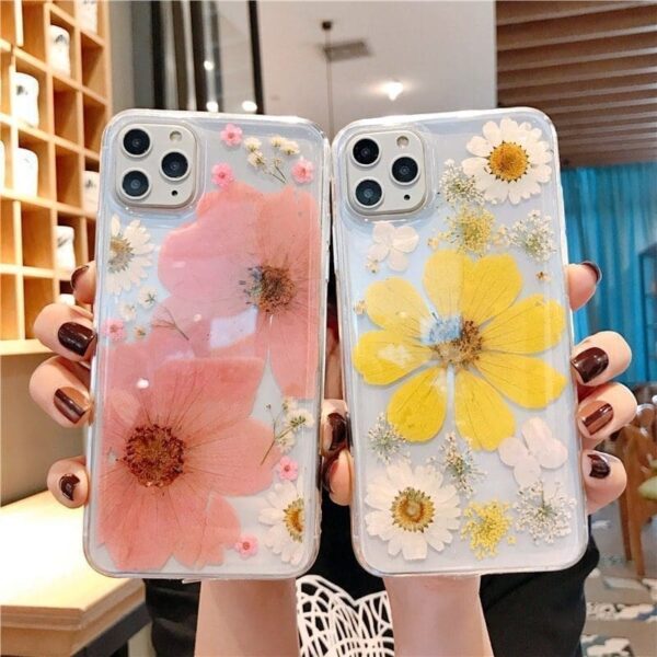 someone holding two transparent pink and yellow floral designed Flower Phone Case – Stylish TPU Back Cover with Floral Design