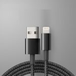 MFI Certified Charging Cable with USB and Lightning connectors coiled neatly against a grey background, indicating durability and high-quality design suitable for Apple devices.