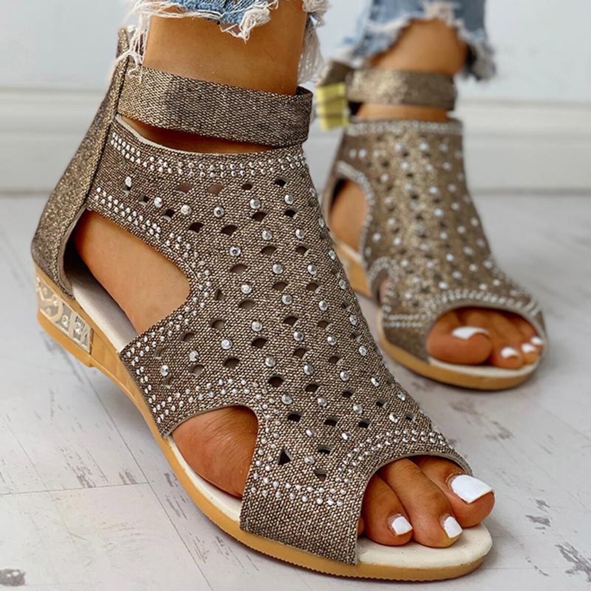 <ul> <li><strong>Glamorous Rhinestone Detail:</strong> Sparkles with every step.</li> <li><strong>Peep-Toe Design:</strong> Keeps your feet cool and stylish.</li> <li><strong>Back Zip Closure:</strong> Easy to put on and remove.</li> <li><strong>Flexible PU Material:</strong> Comfortable and durable for all-day wear.</li> <li><strong>Available in Three Colors:</strong> Black, Beige, Gold.</li> </ul>