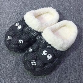 A pair of women's casual black slippers featuring a cat design, made of warm cotton and designed for non-slip comfort.