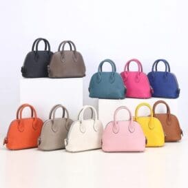 Collection of Women’s Crossbody Genuine Leather Shoulder Bags in various colors displayed on shelves, showcasing a stylish and versatile accessory for fashion-conscious individuals.