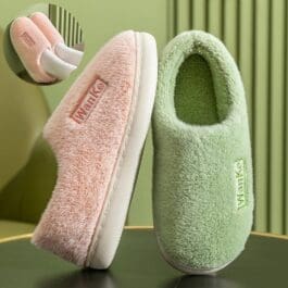 Two women's winter slippers featuring the word "wanke" prominently displayed on each slipper.