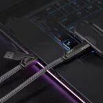 Four-in-One Fast Charge Data Cable connected to a smartphone, showcasing its versatile multi-port design for efficient charging and data transfer.