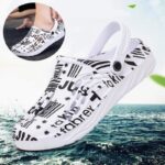 White patterned clog-style shoe floating above the water with a close-up insert showing texture.