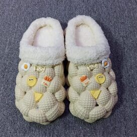 A pair of yellow and white fashion slippers featuring a non-slip litchi bubble design for comfort and style.