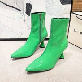 Women’s Pointed Toe Ankle Boots in vibrant green color with a glossy finish, displayed against a minimalist background, highlighting the sleek and fashionable design.