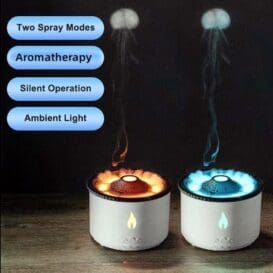 Volcano Aromatherapy Humidifier with dual spray modes, featuring aromatherapy, silent operation, and ambient light functions. Two humidifiers emit mist resembling volcanic smoke against a dark background, one with warm orange light and the other with cool blue light.