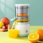 Compact and convenient Portable USB juicer blender on a kitchen counter with fresh oranges, highlighting the product’s ease of use for healthy lifestyle enthusiasts.